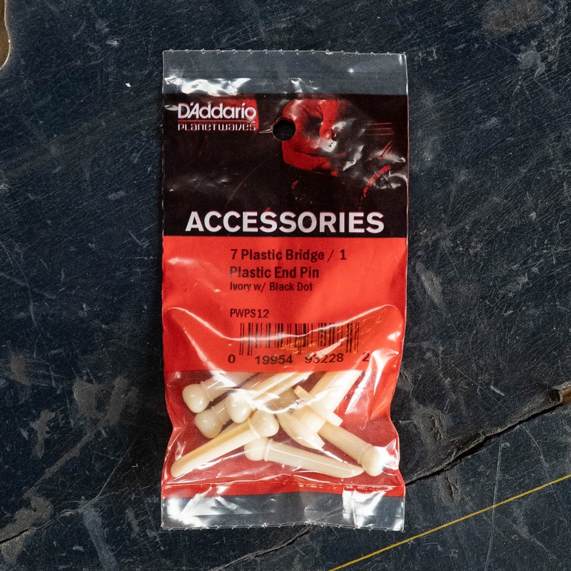D'Addario Injected Molded Bridge Pins with End Pin, Set of 7, Ivory with Ebony Dot - PWPS12